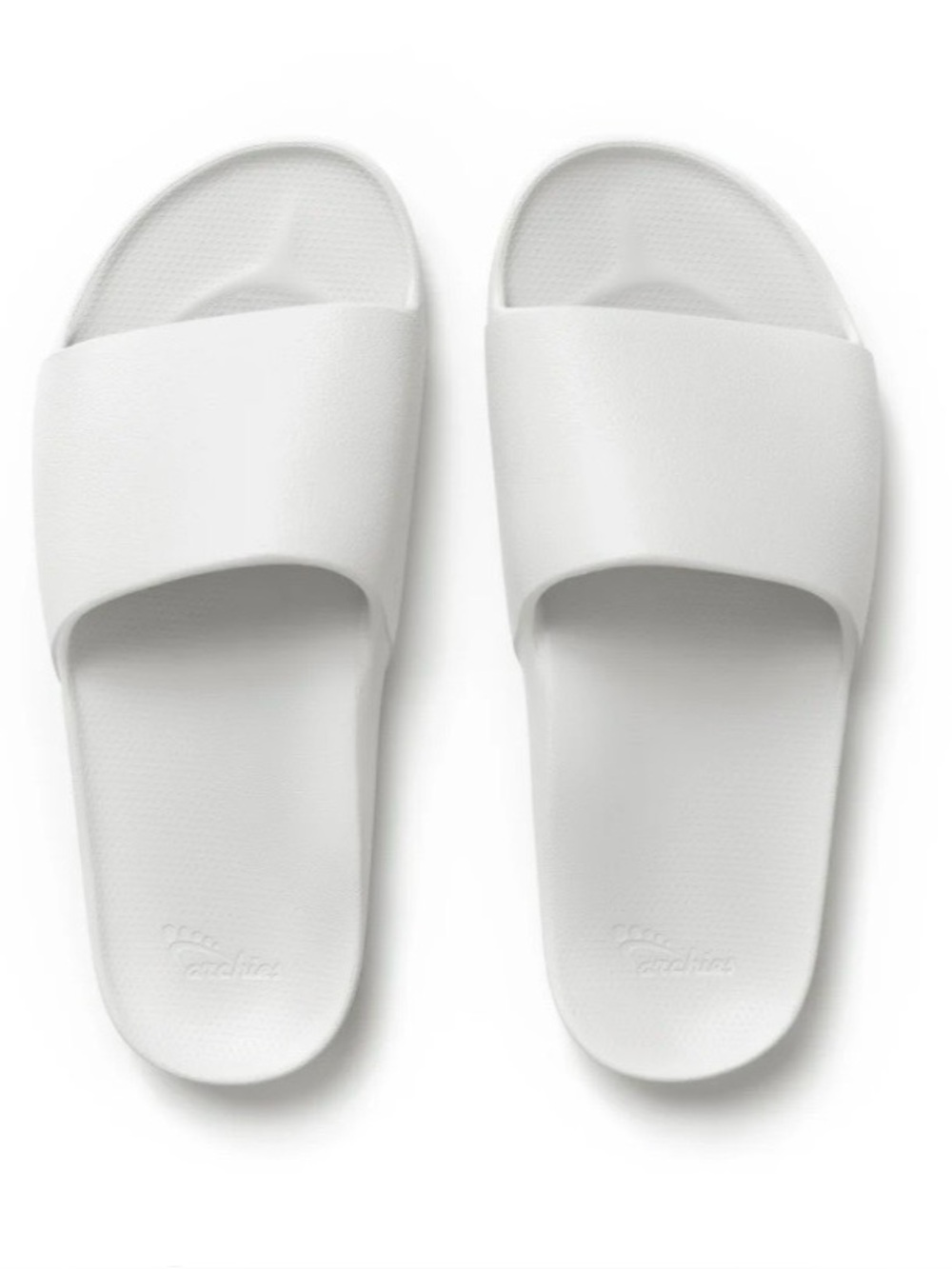 Brand new, never worn white Archie’s slides. Perfect summer essential.